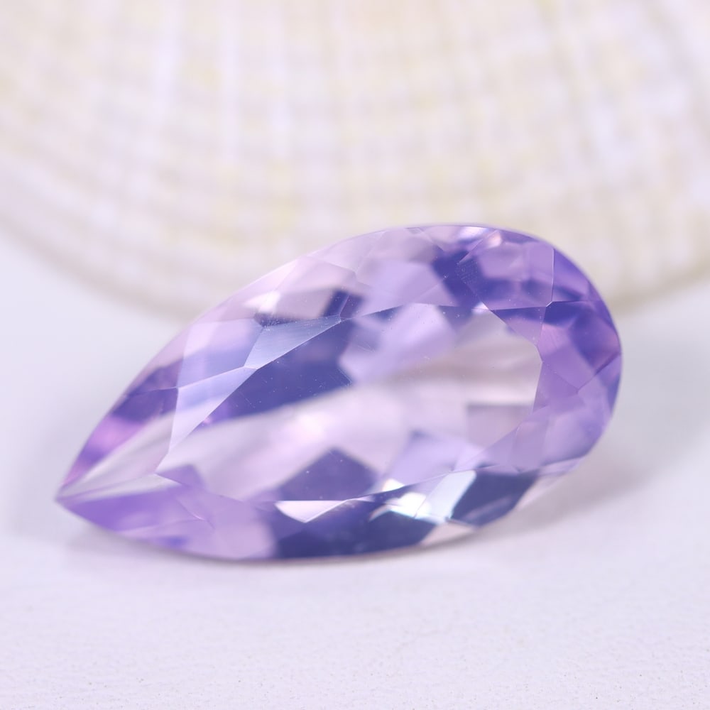 9.37Ct Lavender Amethyst - Polished Faceted , 942E: Ksmith Heritage Auctioneers Subject: Natural Lavender Amethyst Origin: Brazil Carat Weight: 9.37Ct Dimension: 20.4x11.1x8 mm Treatment: Untreated Type: Faceted, Polished