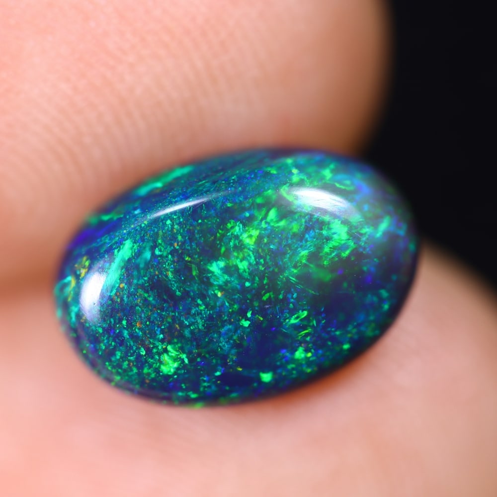 2.01Ct Welo Black Opal Polished - Ethiopian Opal , 189E: Ksmith Heritage Auctioneers Subject: Natural Ethiopian Welo Black Opal Origin: Ethiopia Carat Weight: 2.01Ct Dimension: 11.3x7.8x3.8 mm Treatment: Smoked Type: Cabochon, P