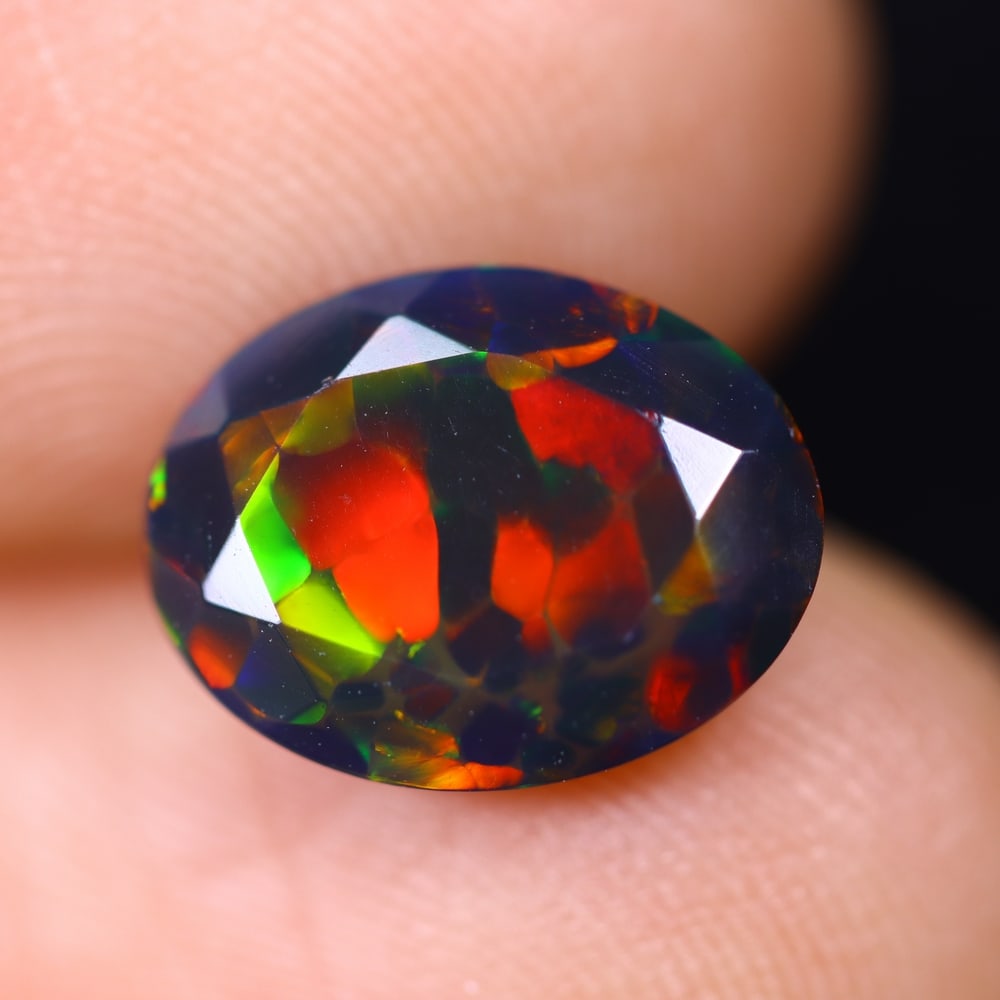 1.70Ct Welo Black Opal Polished - Ethiopian Opal , 782E: Ksmith Heritage Auctioneers Subject: Natural Ethiopian Welo Black Opal Origin: Ethiopia Carat Weight: 1.70Ct Dimension: 11.1x8.6x4.5 mm Treatment: Smoked Type: Faceted, Po