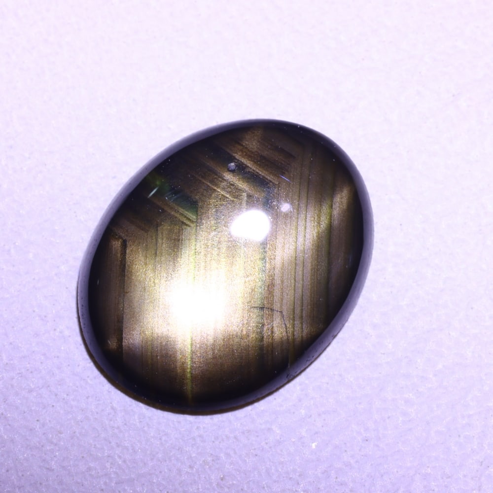 1.98cts 6 Rays Black Star Sapphire , 550E: Ksmith Heritage Auctioneers Subject: Natural 6 Rays Star Sapphire Origin: Myanmar Carat Weight: 1.98 cts Dimension: 9.8x7.7x1.8 mm Treatment: Diffusion Type: Cabochon, Pol