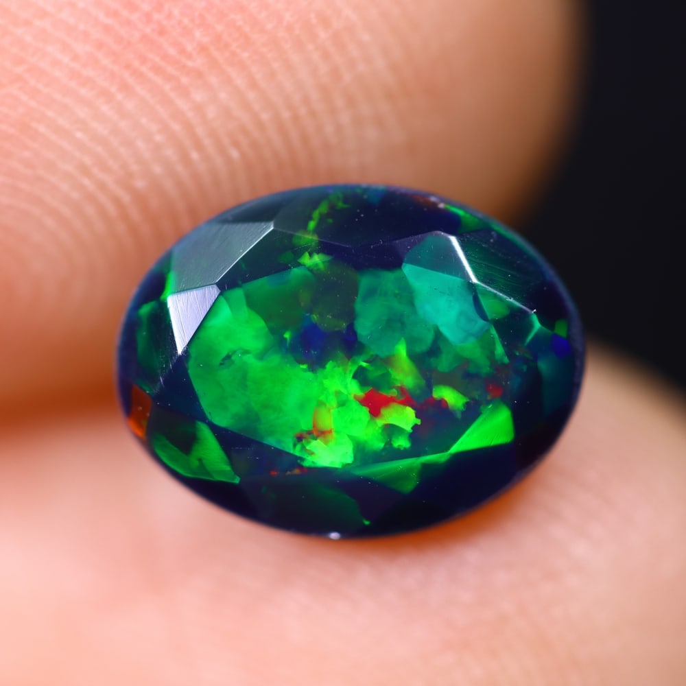 1.57Ct Welo Black Opal Polished - Ethiopian Opal , 1215E: Ksmith Heritage Auctioneers Subject: Natural Ethiopian Welo Black Opal Origin: Ethiopia Carat Weight: 1.57Ct Dimension: 9.9x7.6x5 mm Treatment: Smoked Type: Faceted, Polis