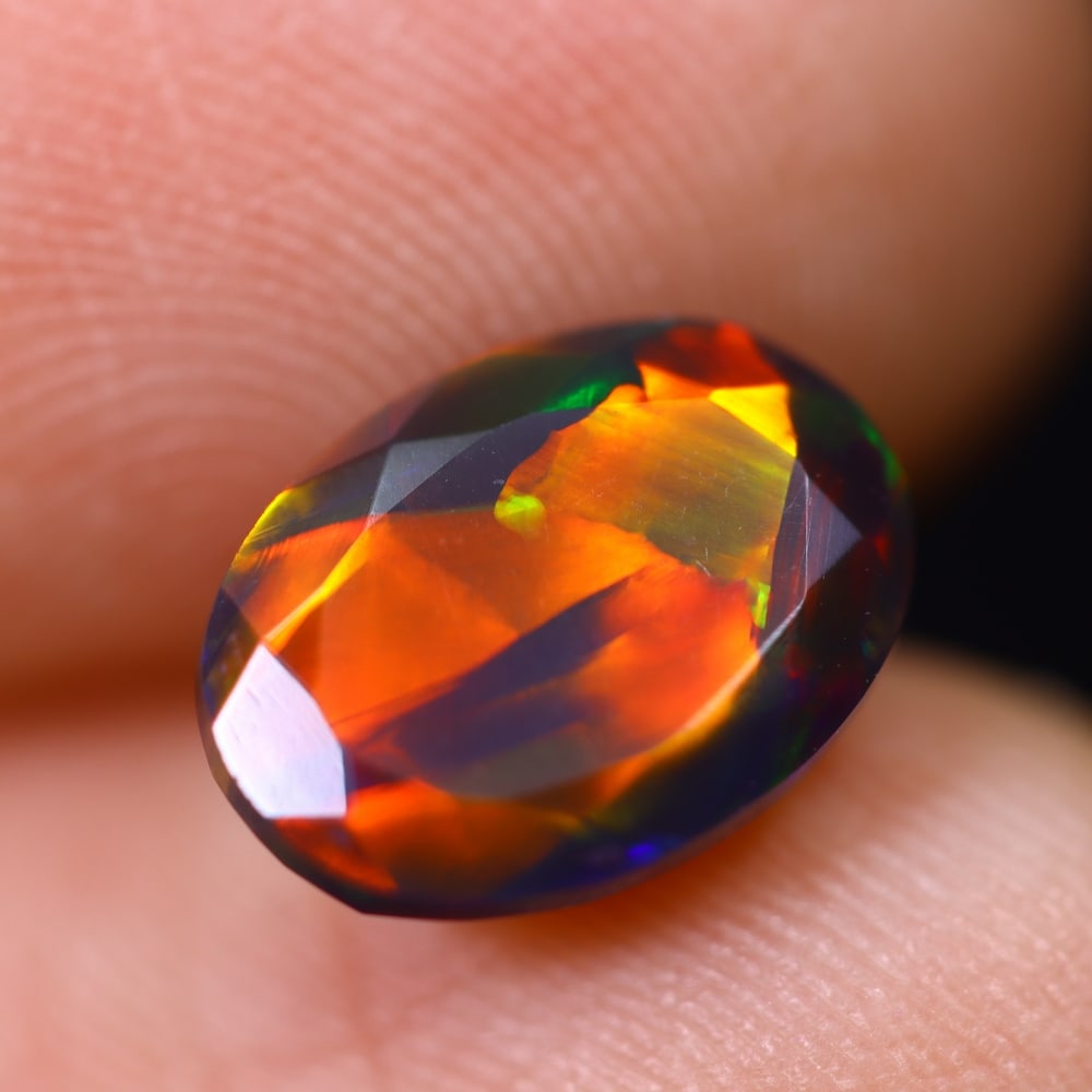 1.70Ct Welo Black Opal Polished - Ethiopian Opal , 297E: Ksmith Heritage Auctioneers Subject: Natural Ethiopian Welo Black Opal Origin: Ethiopia Carat Weight: 1.70Ct Dimension: 10.3x7.5x5.1 mm Treatment: Smoked Type: Faceted, Po