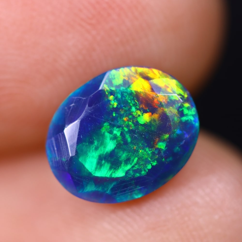 1.47Ct Welo Black Faceted Opal Polished - Ethiopian Opal , 449E: Ksmith Heritage Auctioneers Subject: Natural Ethiopian Welo Black Opal Origin: Ethiopia Carat Weight: 1.47Ct Dimension: 9.7x7.9x4.6 mm Treatment: Smoked Type: Faceted, Pol