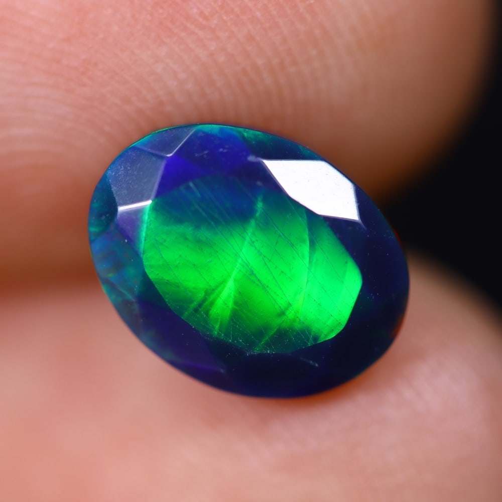 1.54Ct Welo Black Faceted Opal Polished - Ethiopian Opal , 529E: Ksmith Heritage Auctioneers Subject: Natural Ethiopian Welo Black Opal Origin: Ethiopia Carat Weight: 1.54Ct Dimension: 9.8x7.6x4.7 mm Treatment: Smoked Type: Faceted, Pol