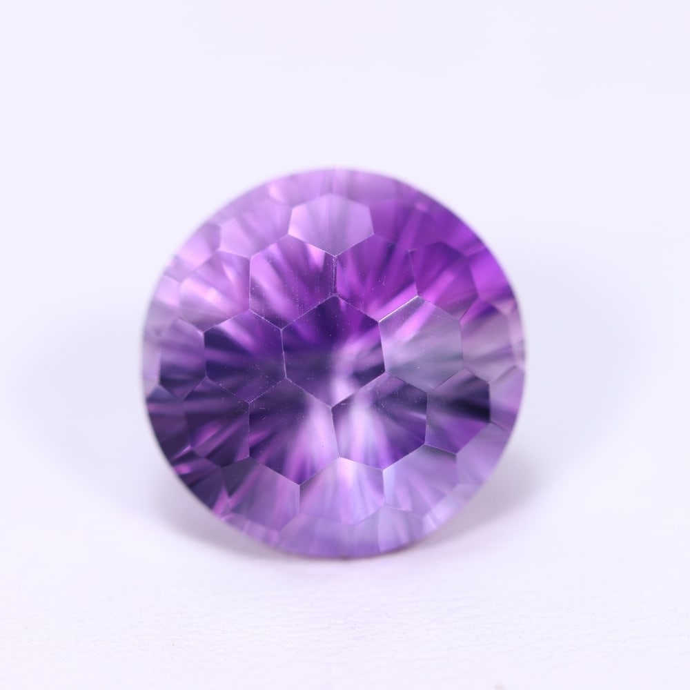 13.13Ct Purple Amethyst - Polished Faceted, 456B: Ksmith Heritage Auctioneers Subject: Natural Amethyst Origin: Brazil Carat Weight: 13.13Ct Dimension: 14.9x14.9x12.2 mm Treatment: Untreated Type: Faceted, Polished
