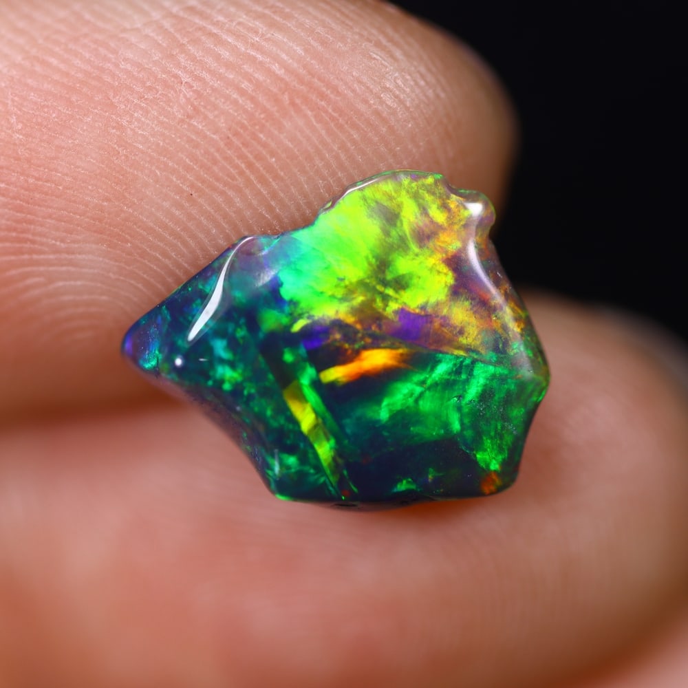 *1.92Ct Smoked Freeform Welo Opal Polished - Ethiopian Opal , 202C: Ksmith Heritage Auctioneers Subject: Natural Ethiopian Welo Opal Origin: Ethiopia Carat Weight: 1.92Ct Dimension: 12.8x11x4.5 mm Treatment: Smoked Type: Freeform, Polished