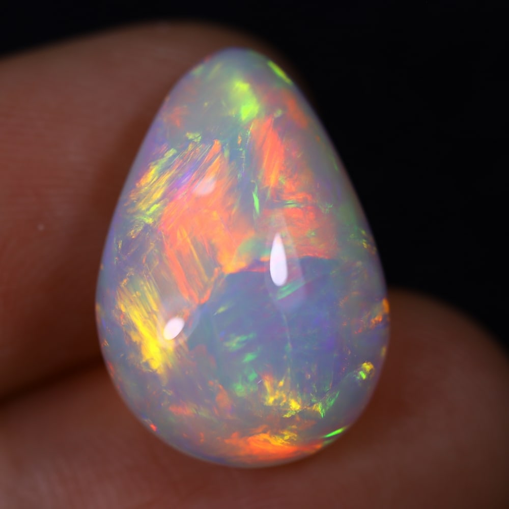 *9.61Ct Welo Opal Polished - Ethiopian Opal , 882E: Ksmith Heritage Auctioneers Subject: Natural Ethiopian Welo Opal Origin: Ethiopia Carat Weight: 9.61Ct Dimension: 19x13x7.8 mm Treatment: Natural Untreated Type: Cabochon,
