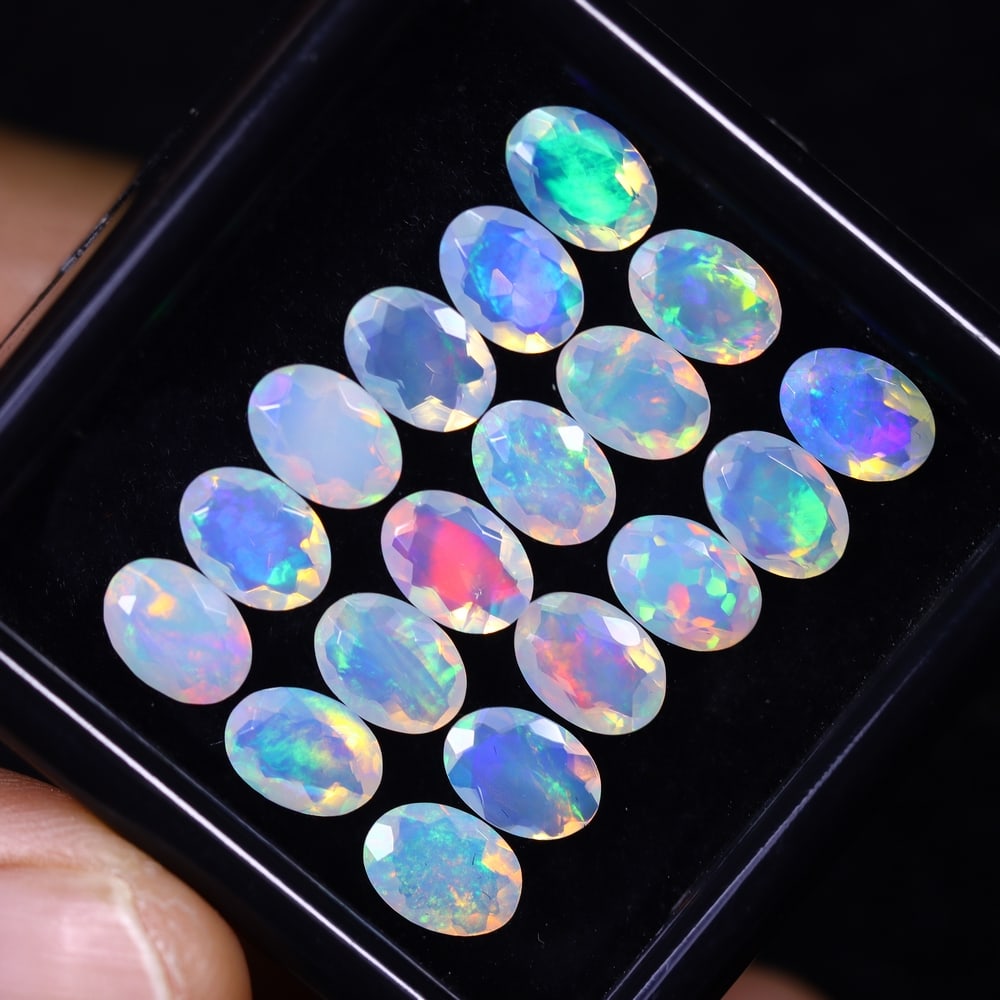 *9.28Ct 18pcs Calibrated 7x5mm Faceted Welo Opal Set - Ethiopian Opal, 824B: Ksmith Heritage Auctioneers Subject: Natural Ethiopian Welo Opal Origin: Ethiopia Carat Weight: 9.28Ct Treatment: Natural Untreated Type: Faceted, Polished