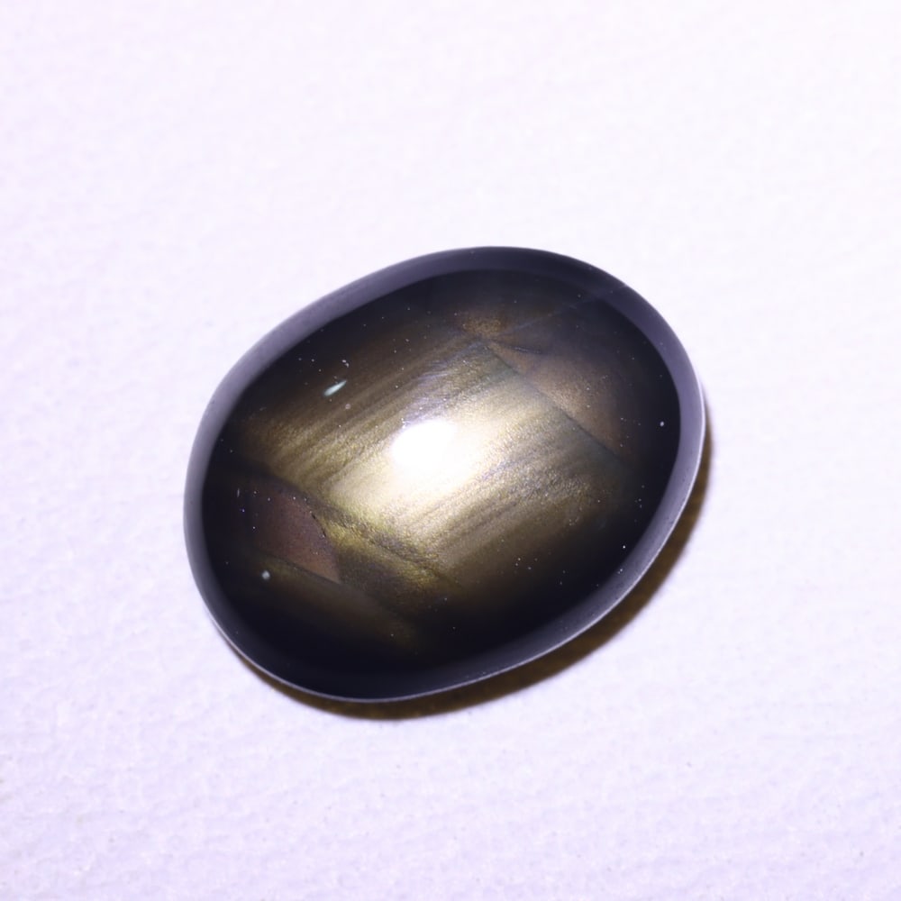 2.41cts 6 Rays Black Star Sapphire , 628E: Ksmith Heritage Auctioneers Subject: Natural 6 Rays Star Sapphire Origin: Myanmar Carat Weight: 2.41cts Dimension: 8.9x6.9x3 mm Treatment: Diffusion Type: Cabochon, Polish