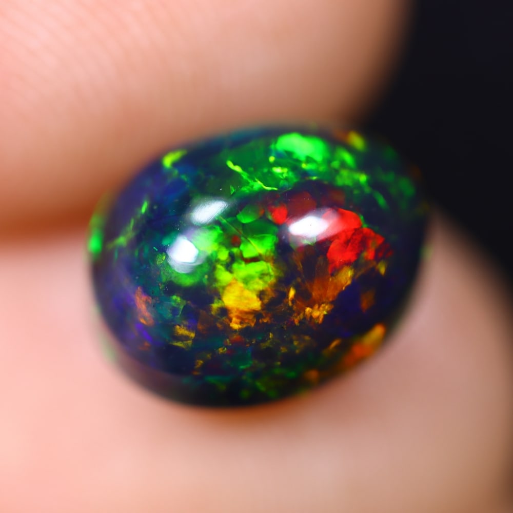 2.48Ct Welo Black Opal Polished - Ethiopian Opal, 926B: Ksmith Heritage Auctioneers Subject: Natural Ethiopian Welo Black Opal Origin: Ethiopia Carat Weight: 2.48Ct Dimension: 10.1x7.9x5.7 mm Treatment: Smoked Type: Cabochon, Polish