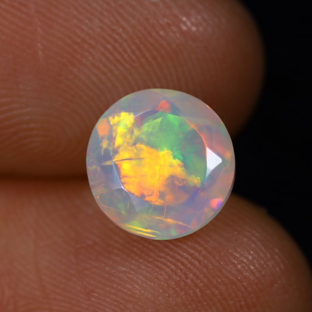 1.82Ct Welo Opal Faceted Polished - Ethiopian Opal , 731E: Ksmith Heritage Auctioneers Subject: Natural Ethiopian Welo Opal Origin: Ethiopia Carat Weight: 1.82Ct Dimension: 8.9x8.6x4.8 mm Treatment: Natural Untreated Type: Faceted