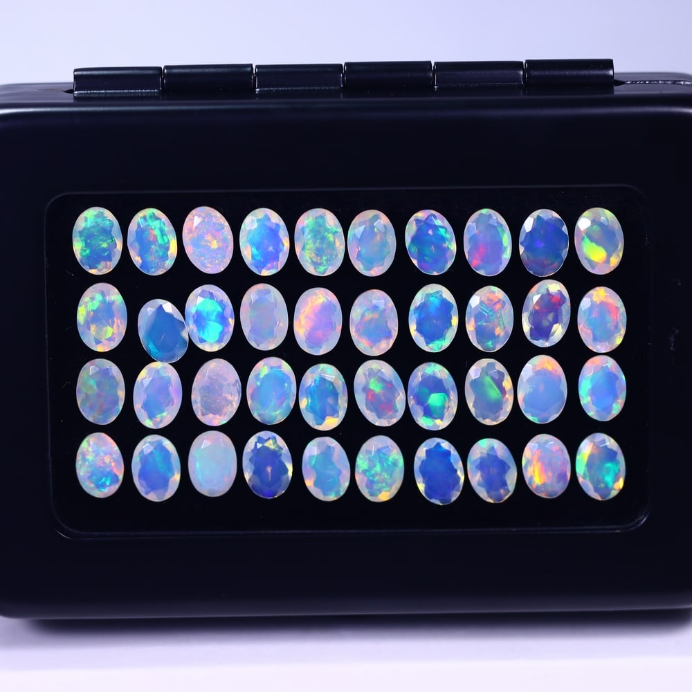 *19.50Ct Calibrated 7x5mm Faceted Welo Opal Set - Ethiopian Opal , 135E: Ksmith Heritage Auctioneers Subject: Natural Ethiopian Welo Opal Origin: Ethiopia Carat Weight: 19.50Ct Treatment: Natural Untreated Type: Faceted, Polished