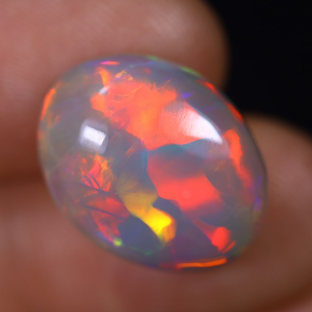 *7.05Ct Welo Opal Polished - Ethiopian Opal , 222E: Ksmith Heritage Auctioneers Subject: Natural Ethiopian Welo Opal Origin: Ethiopia Carat Weight: 7.05Ct Dimension: 17x13.4x6.2 mm Treatment: Natural Untreated Type: Cabocho