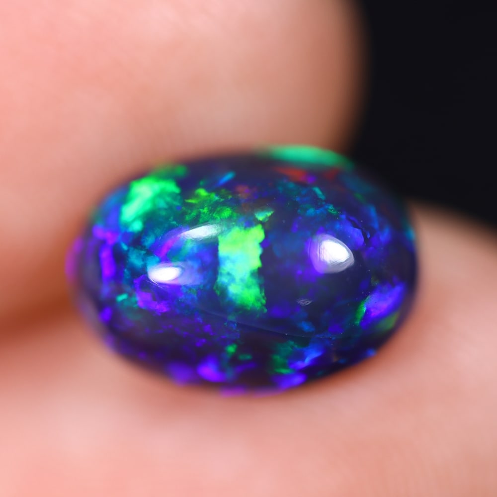 2.04Ct Welo Black Opal Polished - Ethiopian Opal , 170E: Ksmith Heritage Auctioneers Subject: Natural Ethiopian Welo Black Opal Origin: Ethiopia Carat Weight: 2.04Ct Dimension: 11.2x7.9x4.8 mm Treatment: Smoked Type: Cabochon, P