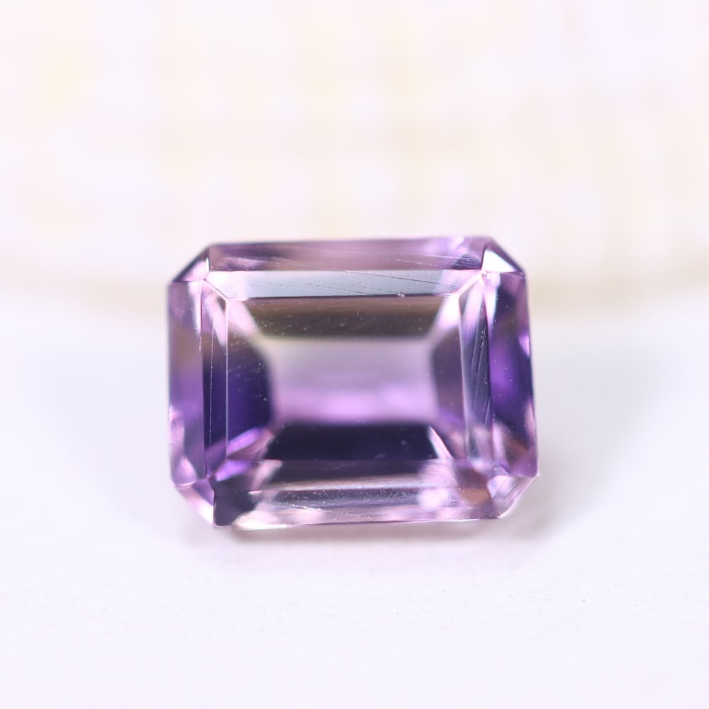 1.66Ct Ametrine - Polished Faceted - Rectangle Faceted , 750E: Ksmith Heritage Auctioneers Subject: Natural Ametrine Origin: Bolivia Carat Weight: 1.66Ct Dimension: 7.7x6x4.6 mm Treatment: Unheated Shape: Rectangle Type: Fac
