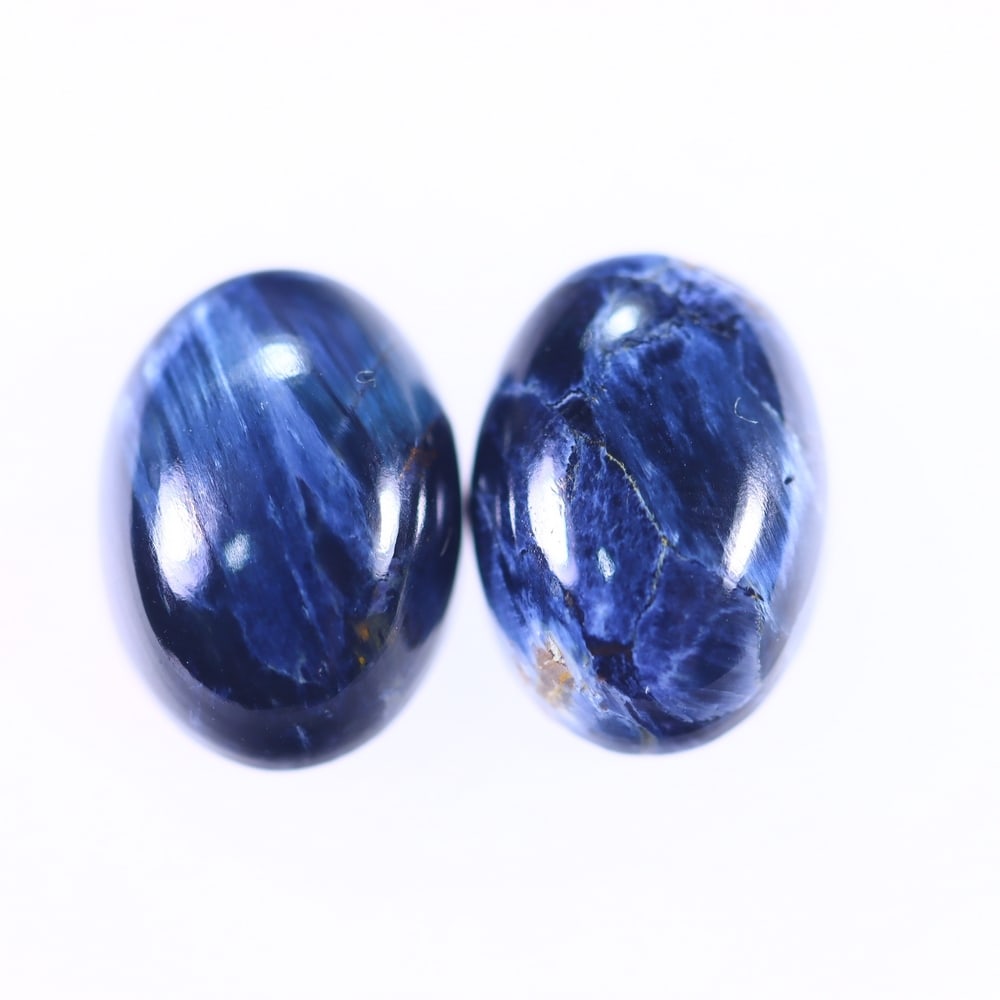11.22Ct Pietersite Cabochon Pair - Gemstone Crystal - Oval Cabochon, 1206B: Ksmith Heritage Auctioneers Subject: Natural Pietersite Origin: Namibia, South Africa Carat Weight: 11.22Ct Dimension: 13.9 x 10.2 x 5.1 mm Treatment: Natural Untreated Shape: