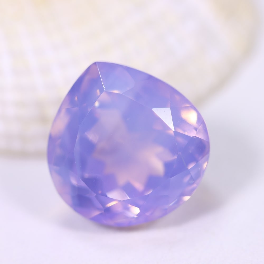 13.12Ct Lavender Amethyst - Polished Faceted , 1243E: Ksmith Heritage Auctioneers Subject: Natural Lavender Amethyst Origin: Brazil Carat Weight: 13.12Ct Dimension: 15.1x14.7x10.8 mm Treatment: Untreated Type: Faceted, Polish