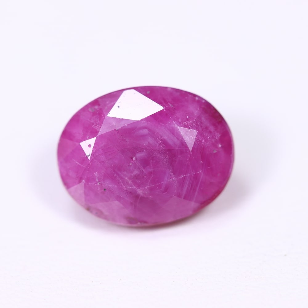 5.94Ct Red Ruby - Polished Faceted , 673E: Ksmith Heritage Auctioneers Subject: Natural Ruby Origin: Burma Carat Weight: 5.94Ct Dimension: 11.3x8.8x6.3 mm Treatment: Heated Type: Faceted, Polished