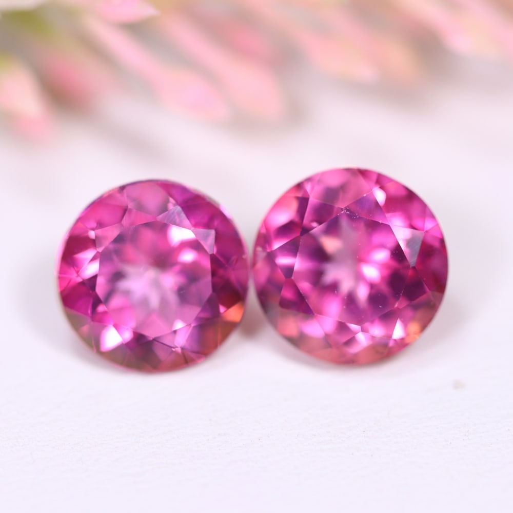 9.22Ct Pink Topaz Pair - Polished Faceted , 1161E: Ksmith Heritage Auctioneers Subject: Natural Pink Topaz Origin: Myanmar Carat Weight: 9.22Ct Dimension: 10x9.9x6.9 mm Treatment: Coated Type: Faceted, Polished