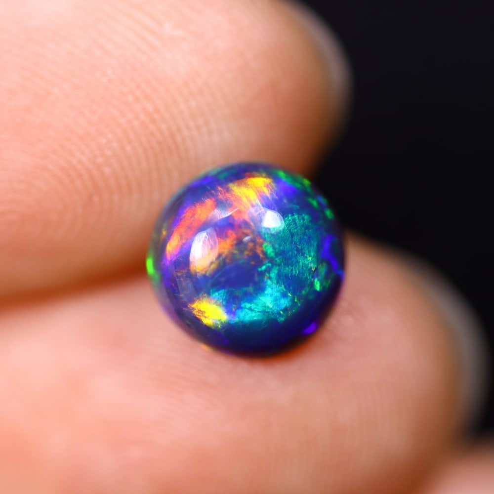 *1.37Ct Smoked Welo Opal Polished - Ethiopian Opal , 302C: Ksmith Heritage Auctioneers Subject: Natural Ethiopian Welo Opal Origin: Ethiopia Carat Weight: 1.37Ct Dimension: 8.2x8.1x4 mm Treatment: Smoked Type: Cabochon, Polished
