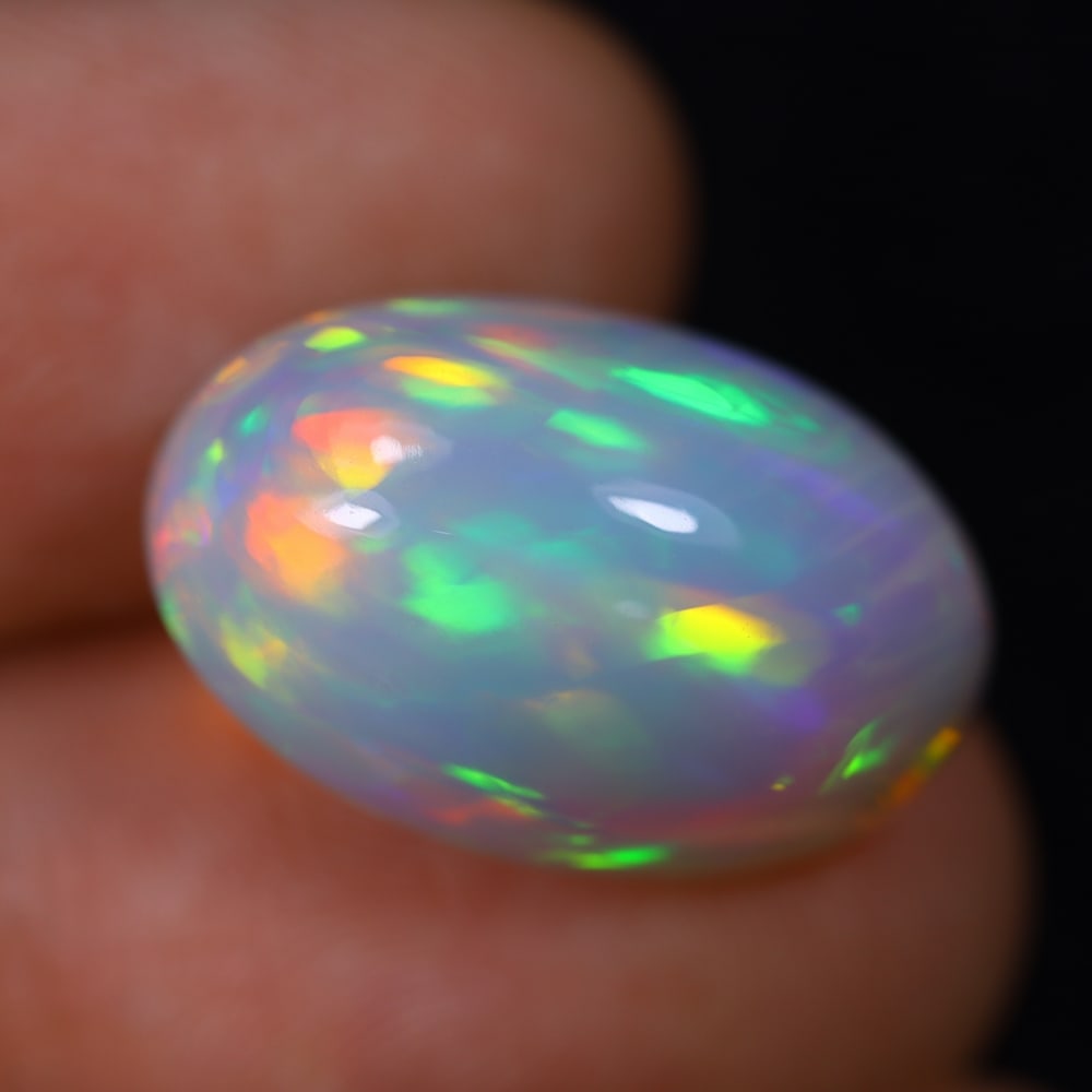 *10.83Ct Welo Opal Polished - Ethiopian Opal, 1154B: Ksmith Heritage Auctioneers Subject: Natural Ethiopian Welo Opal Origin: Ethiopia Carat Weight: 10.83Ct Dimension: 19x12.3x9.4 mm Treatment: Natural Untreated Type: Cabochon, P