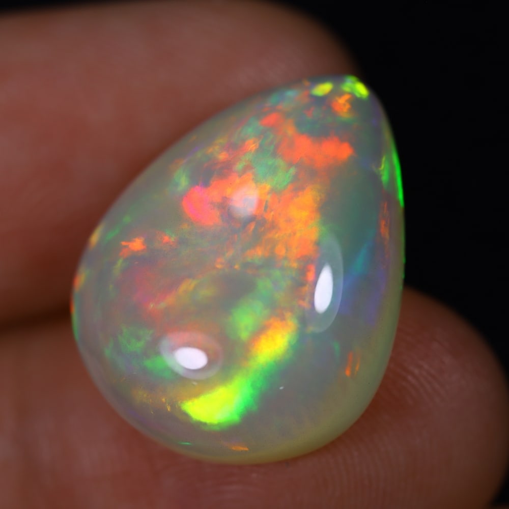 *11.50Ct Welo Opal Polished - Ethiopian Opal, 415B: Ksmith Heritage Auctioneers Subject: Natural Ethiopian Welo Opal Origin: Ethiopia Carat Weight: 11.50Ct Dimension: 19.7x16x7.5 mm Treatment: Natural Untreated Type: Cabochon, P