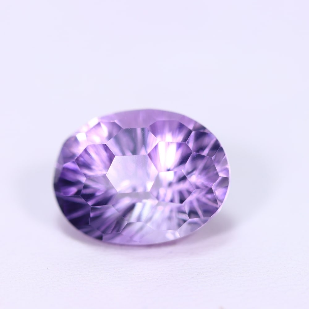 9.95Ct Purple Amethyst - Polished Faceted, 471B: Ksmith Heritage Auctioneers Subject: Natural Amethyst Origin: Brazil Carat Weight: 9.95Ct Dimension: 15.5x11.7x10.1 mm Treatment: Untreated Type: Faceted, Polished
