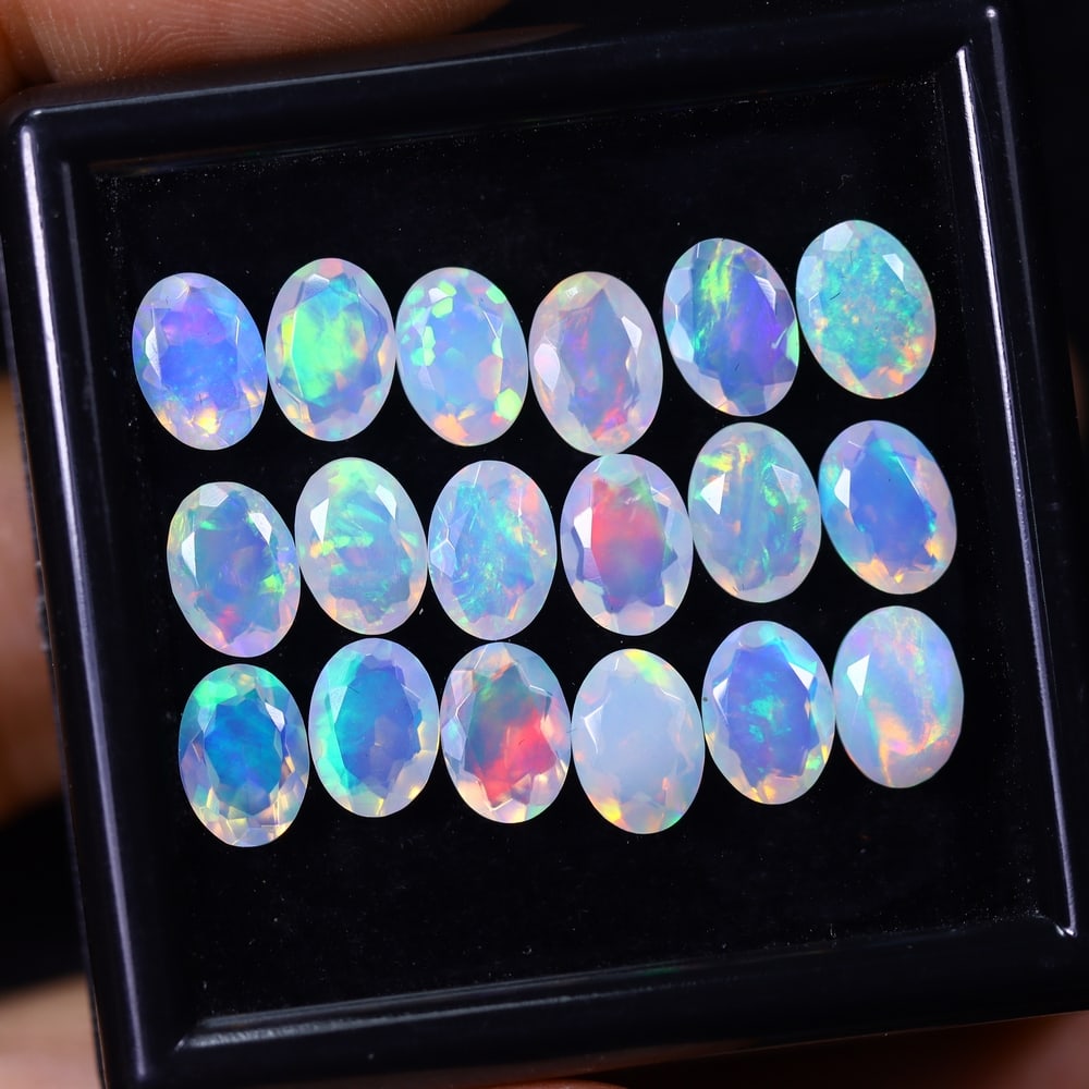 *9.17Ct 18pcs Calibrated 7x5mm Faceted Welo Opal Set - Ethiopian Opal, 547B: Ksmith Heritage Auctioneers Subject: Natural Ethiopian Welo Opal Origin: Ethiopia Carat Weight: 9.17Ct Treatment: Natural Untreated Type: Faceted, Polished