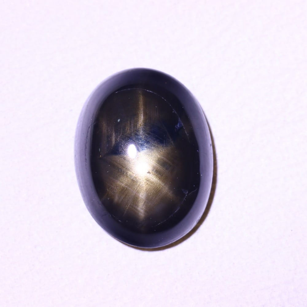 2.33cts 6 Rays Black Star Sapphire , 430E: Ksmith Heritage Auctioneers Subject: Natural 6 Rays Star Sapphire Origin: Myanmar Carat Weight: 2.33 cts Dimension: 8.8x6.6x3.3 mm Treatment: Diffusion Type: Cabochon, Pol