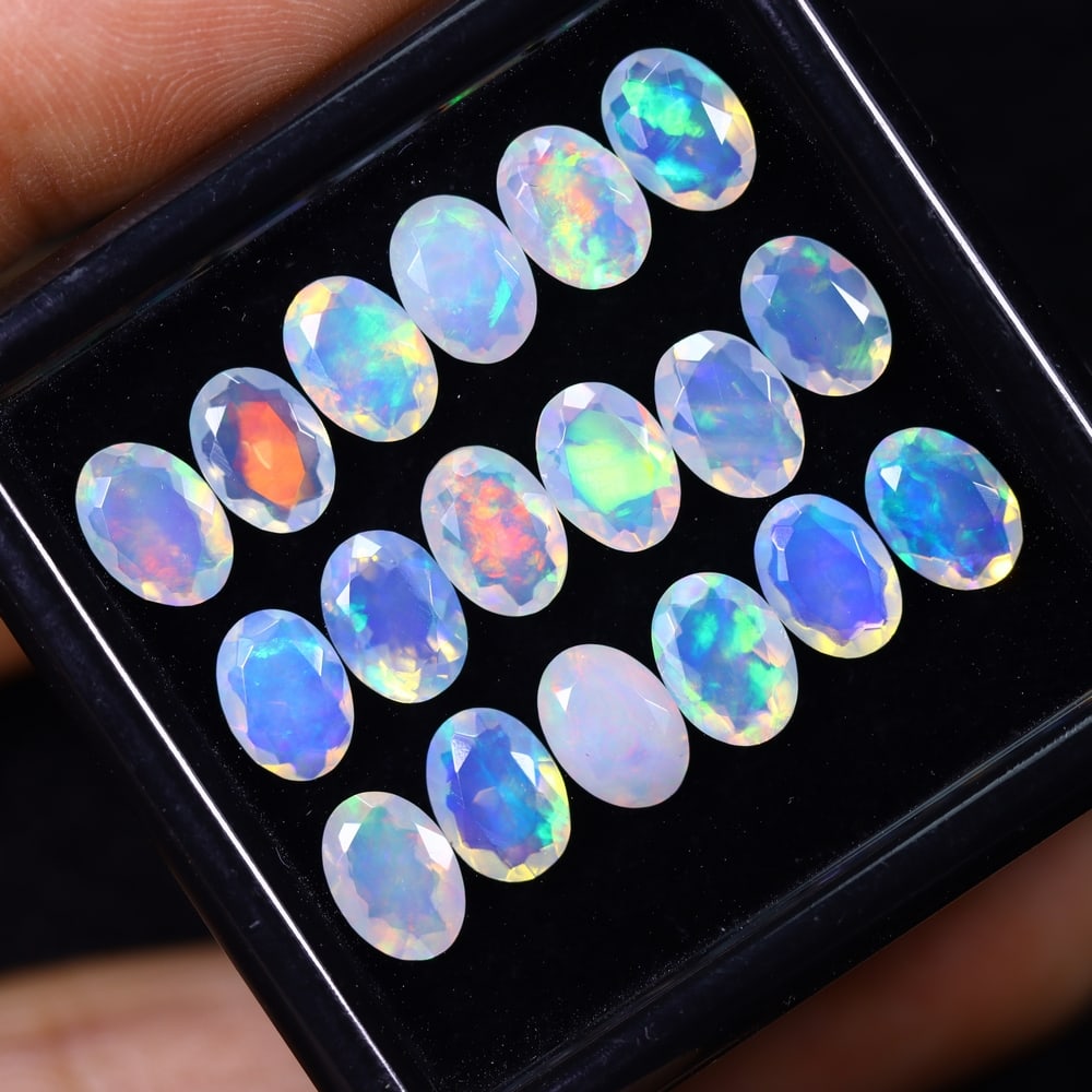 *8.72Ct 18pcs Calibrated 7x5mm Faceted Welo Opal Set - Ethiopian Opal, 1173B: Ksmith Heritage Auctioneers Subject: Natural Ethiopian Welo Opal Origin: Ethiopia Carat Weight: 8.72Ct Treatment: Natural Untreated Type: Faceted, Polished