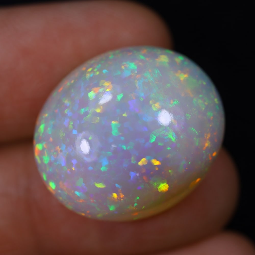 *19.52Ct Welo Opal Polished - Ethiopian Opal, 275B: Ksmith Heritage Auctioneers Subject: Natural Ethiopian Welo Opal Origin: Ethiopia Carat Weight: 19.52Ct Dimension: 21.5x18.6x9 mm Treatment: Natural Untreated Type: Cabochon, P