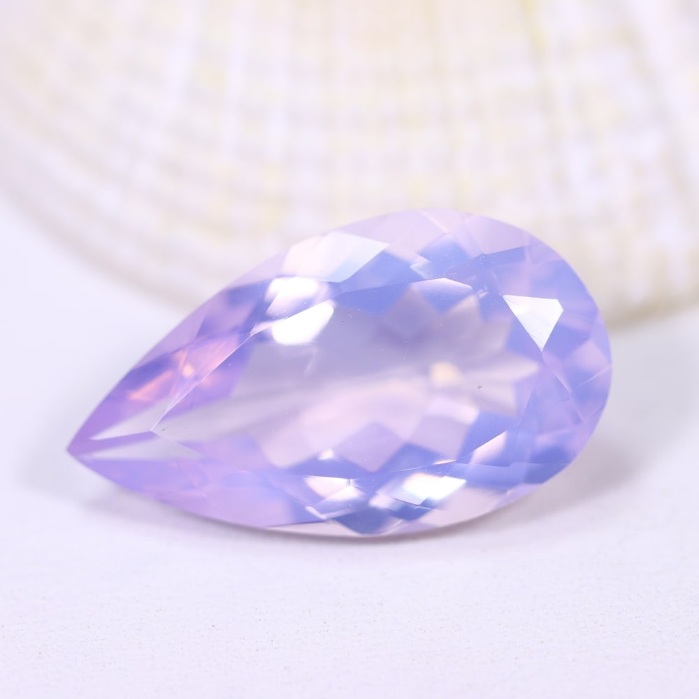 9.09Ct Lavender Amethyst - Polished Faceted , 741E: Ksmith Heritage Auctioneers Subject: Natural Lavender Amethyst Origin: Brazil Carat Weight: 9.09Ct Dimension: 20.5x11.7x7.4 mm Treatment: Untreated Type: Faceted, Polished