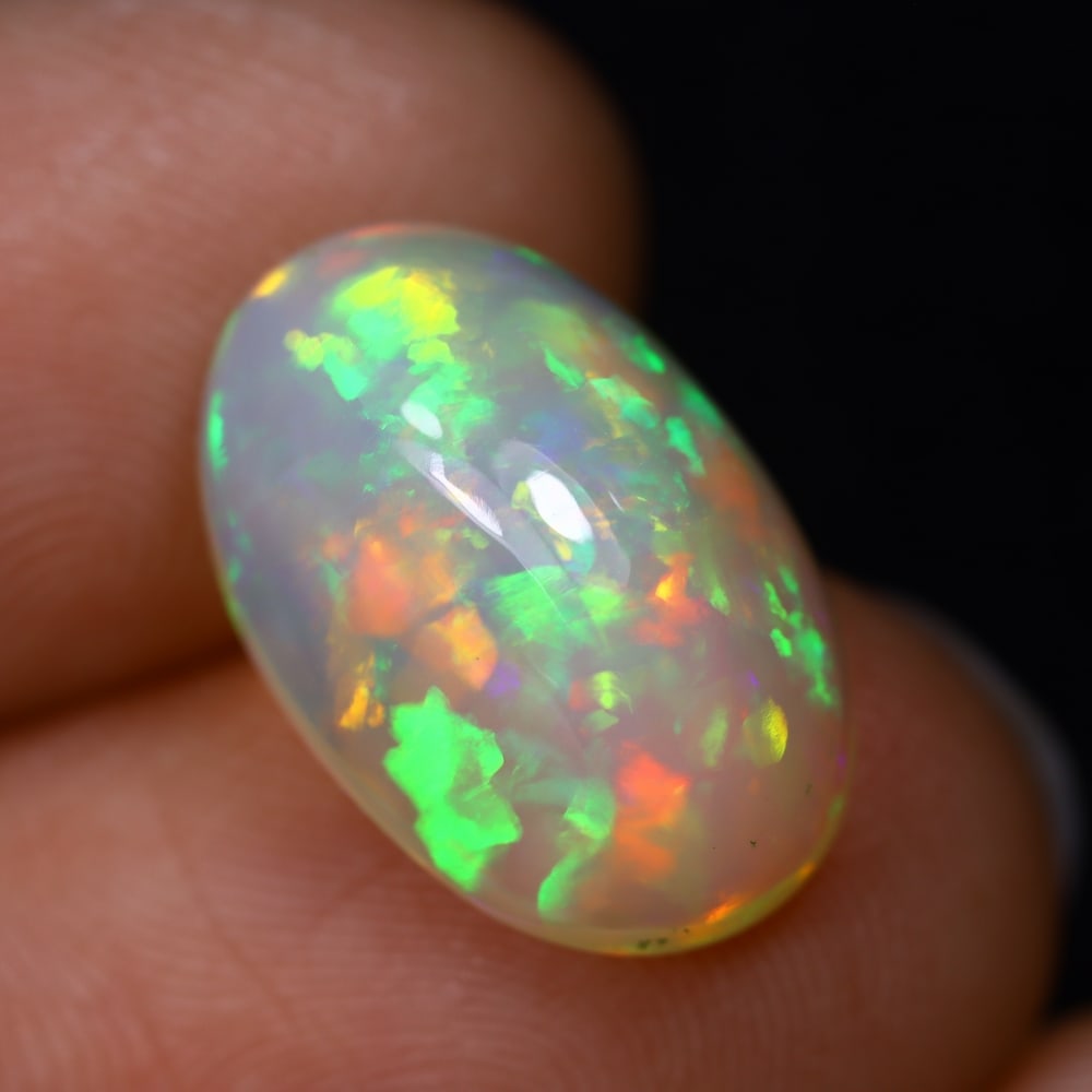 4.81Ct Welo Opal Polished - Ethiopian Opal, 1241B: Ksmith Heritage Auctioneers Subject: Natural Ethiopian Welo Opal Origin: Ethiopia Carat Weight: 4.81Ct Dimension: 15.7x10.4x7.2 mm Treatment: Natural Untreated Type: Cabochon, Polished