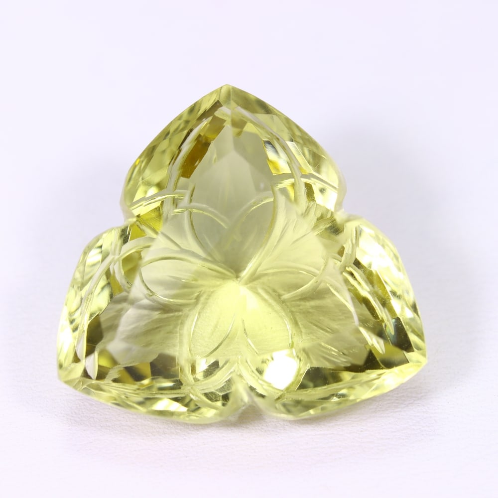 46.03Ct Lemon Carving Quartz - Polished Carving , 306E: Ksmith Heritage Auctioneers Subject: Natural Lemon Quartz Origin: Brazil Carat Weight: 46.03Ct Dimension: 25.6x15.5x13.2 mm Treatment: Untreated Type: Carving, Polished