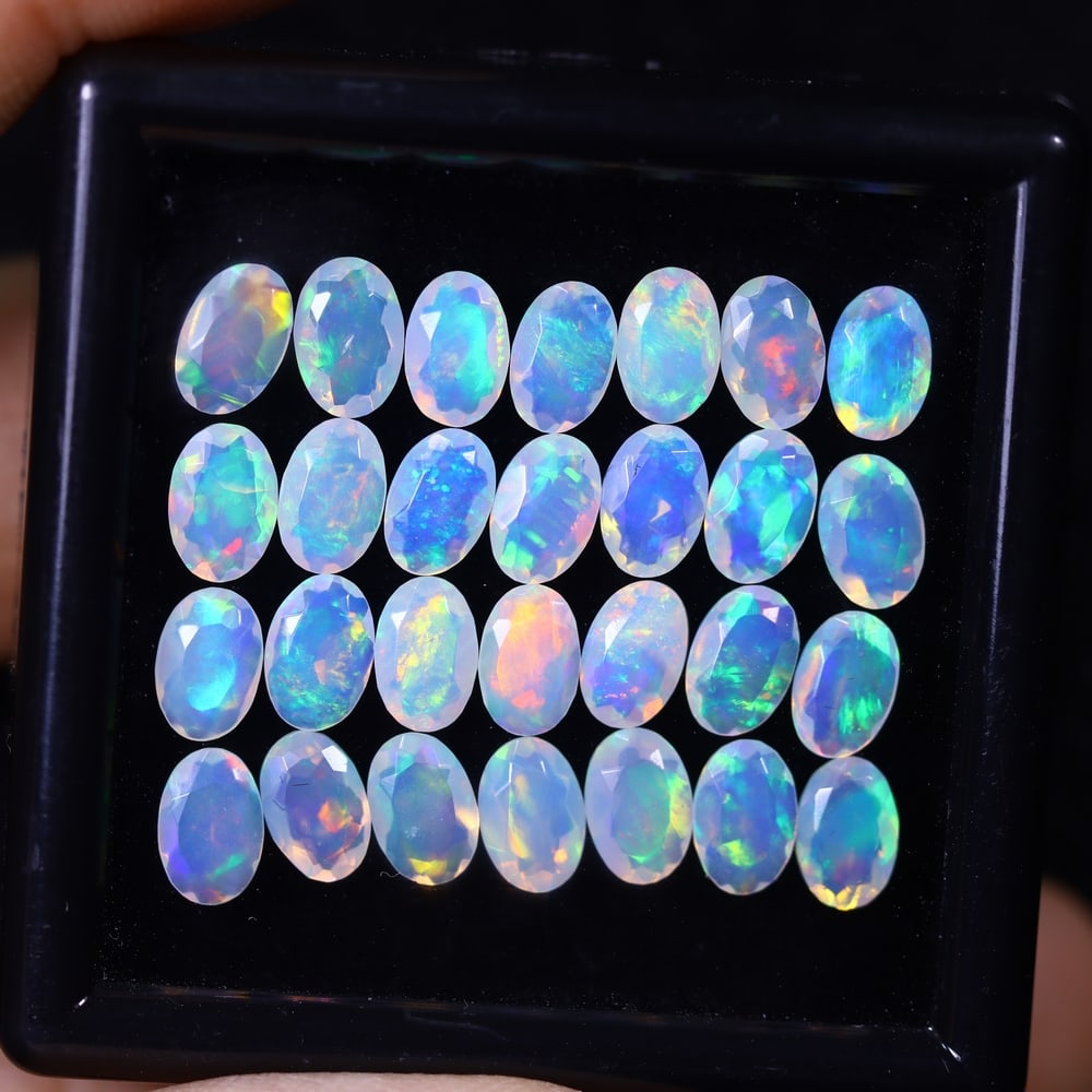 *8.32Ct 28pcs Calibrated 6x4mm Faceted Welo Opal Set - Ethiopian Opal, 252B: Ksmith Heritage Auctioneers Subject: Natural Ethiopian Welo Opal Origin: Ethiopia Carat Weight: 8.32Ct Treatment: Natural Untreated Type: Faceted, Polished