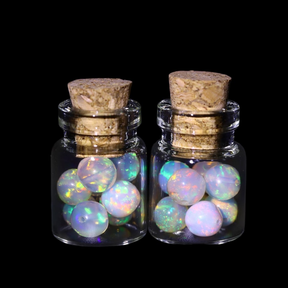 Twin Pack - 4.5mm Ethiopian Opal Ball in Display Jar - Bottle Size 1.5cm , 72C: Ksmith Heritage AuctioneersSubject: Natural Opal (with bottle) Origin: Ethiopia Treatment: Unheated