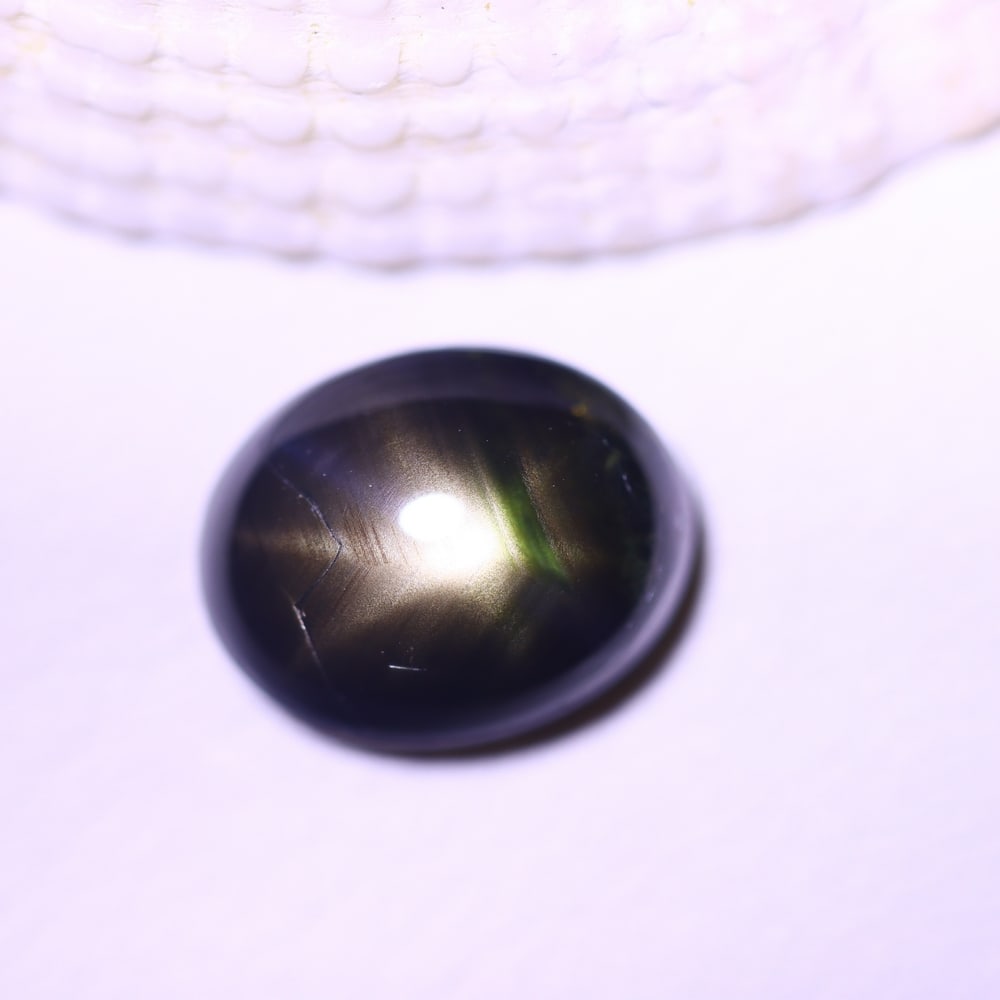 4.33cts 6 Rays Black Star Sapphire , 330E: Ksmith Heritage Auctioneers Subject: Natural 6 Rays Star Sapphire Origin: Myanmar Carat Weight: 4.33cts Dimension: 9.7x7.7x4.9 mm Treatment: Diffusion Type: Cabochon, Poli