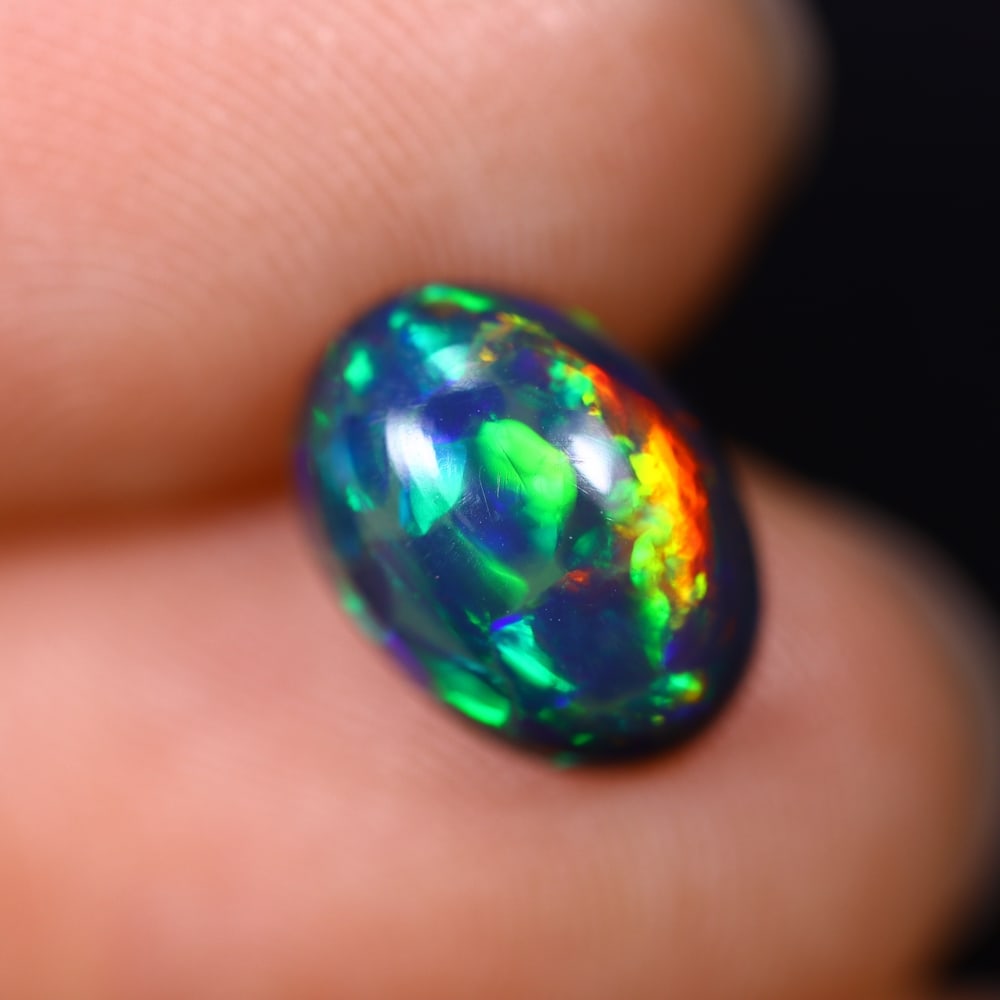 *1.75Ct Smoked Welo Opal Polished - Ethiopian Opal , 310C: Ksmith Heritage Auctioneers Subject: Natural Ethiopian Welo Opal Origin: Ethiopia Carat Weight: 1.75Ct Dimension: 10.5x7.6x4.3 mm Treatment: Smoked Type: Cabochon, Polishe