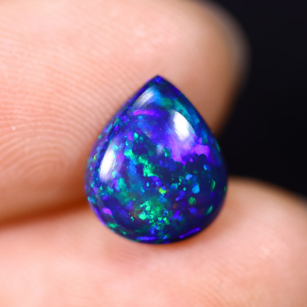 *1.79Ct Smoked Welo Opal Polished - Ethiopian Opal , 307C: Ksmith Heritage Auctioneers Subject: Natural Ethiopian Welo Opal Origin: Ethiopia Carat Weight: 1.79Ct Dimension: 10.7x9x3.8 mm Treatment: Smoked Type: Cabochon, Polished<