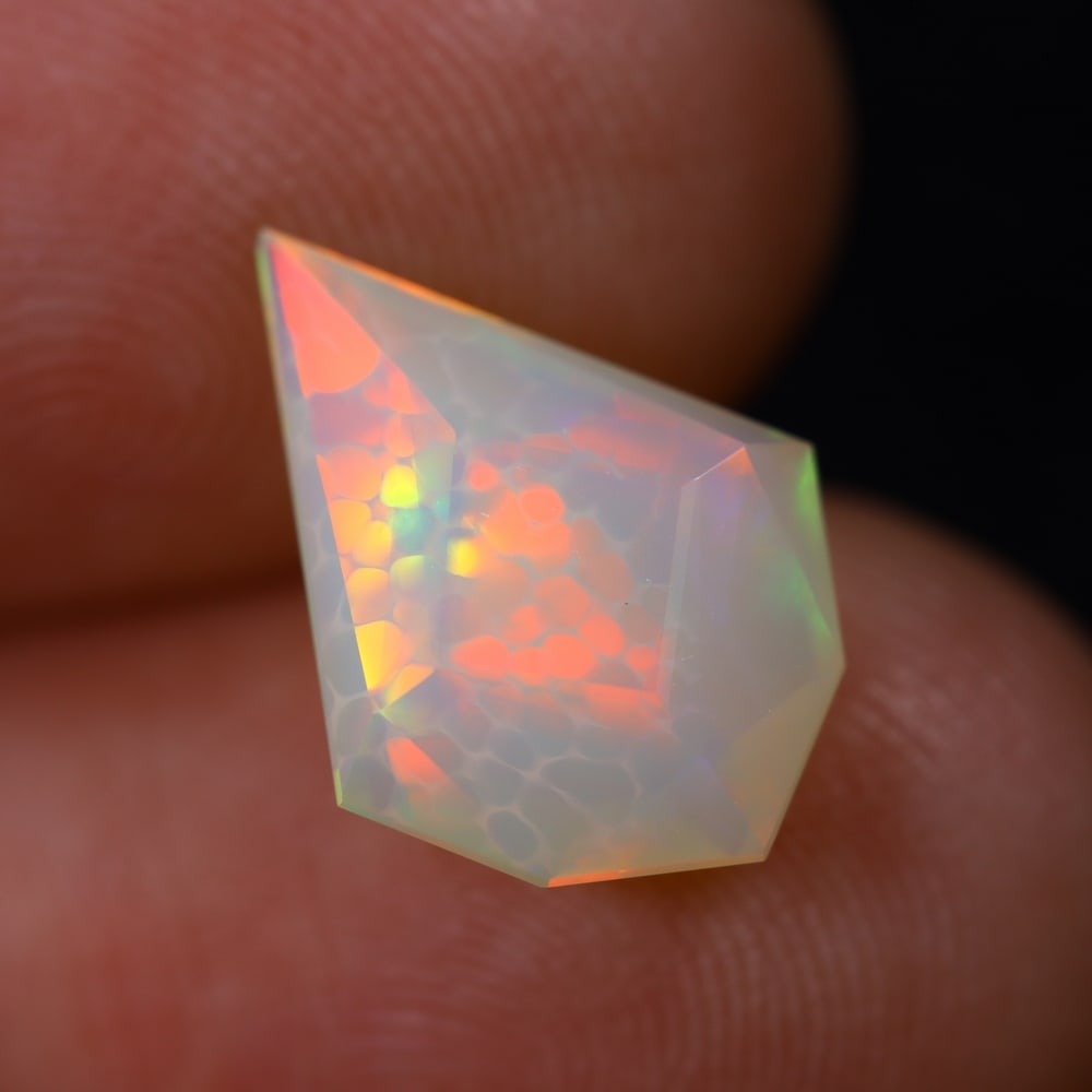 *2.19Ct Special Cut Welo Opal Polished - Ethiopian Opal , 166E: Ksmith Heritage Auctioneers Subject: Natural Ethiopian Welo Opal Origin: Ethiopia Carat Weight: 2.19Ct Dimension: 13.8x10.2x5.1 mm Treatment: Unheated Type: Faceted, Polished