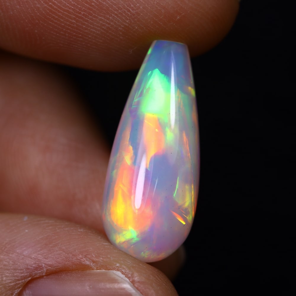 *6.51Ct Teardrop Welo Opal - Ethiopian Opal, 377C: Ksmith Heritage Auctioneers Subject: Natural Ethiopian Welo Opal Origin: Ethiopia Carat Weight: 6.51Ct Dimension: 20.1x8.4x8.4 mm Treatment: Natural Untreated Type: Cabochon, Polished