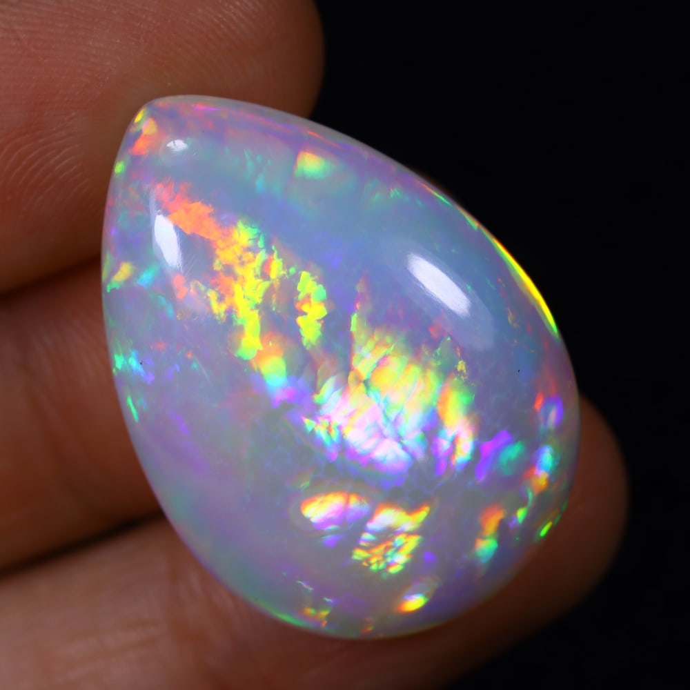 *22.16Ct Welo Opal Polished - Ethiopian Opal , 1136E: Ksmith Heritage Auctioneers Subject: Natural Ethiopian Welo Opal Origin: Ethiopia Carat Weight: 22.26Ct Dimension: 29.2x21x7.9 mm Treatment: Natural Untreated Type: Caboch