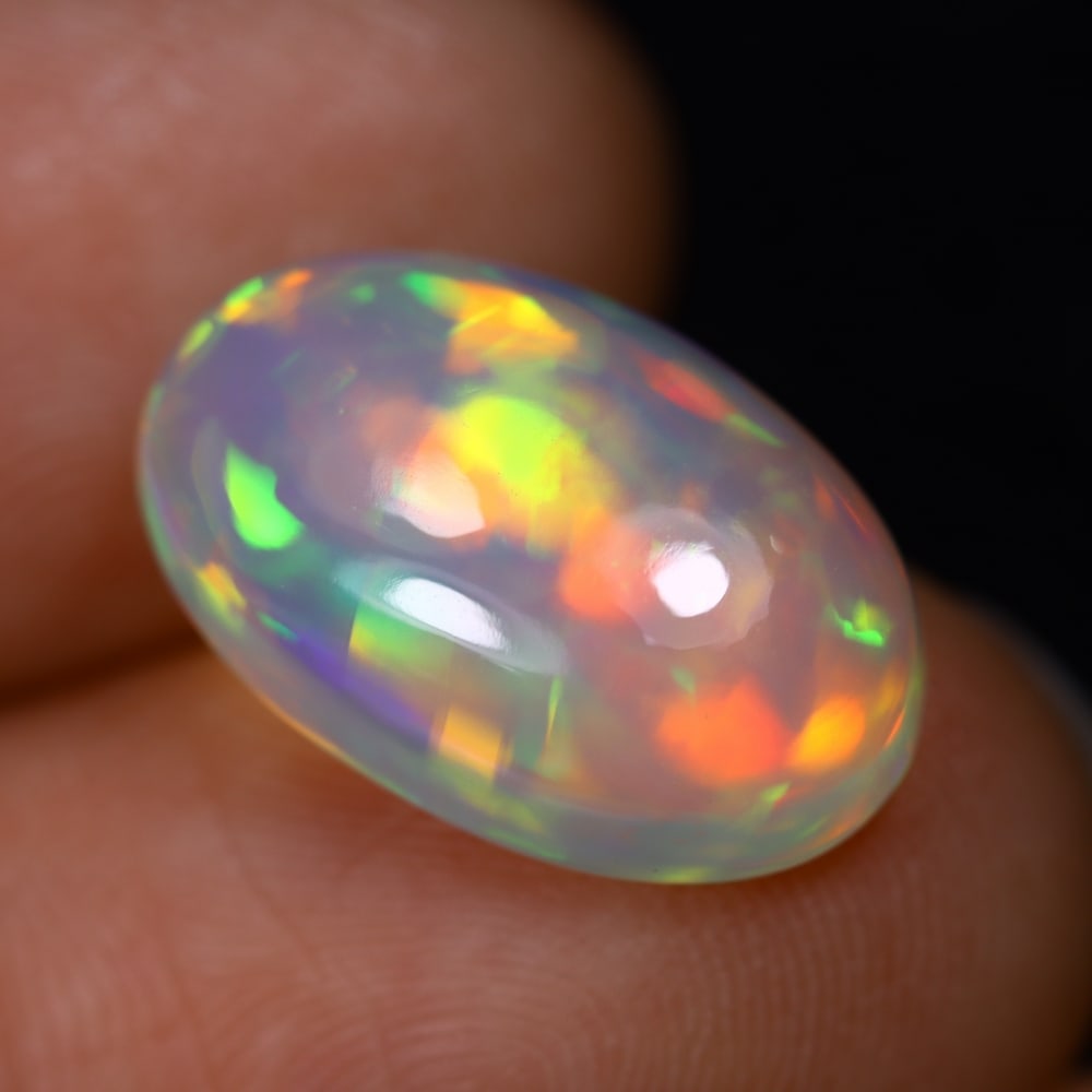 4.81Ct Welo Opal Polished - Ethiopian Opal, 115B: Ksmith Heritage Auctioneers Subject: Natural Ethiopian Welo Opal Origin: Ethiopia Carat Weight: 4.81Ct Dimension: 11.2x10.3x5.5 mm Treatment: Natural Untreated Type: Cabochon, Polished