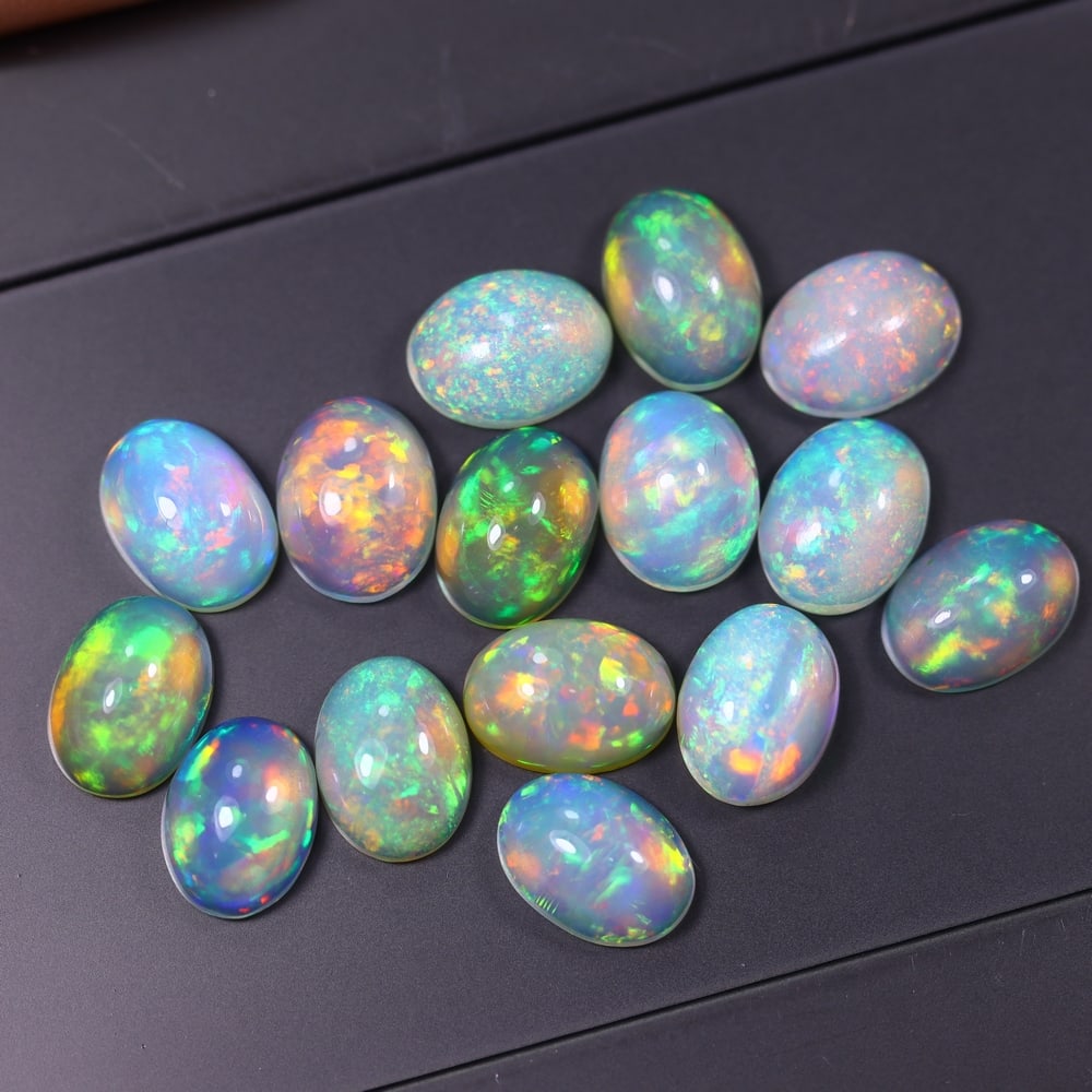 *12.67Ct 8x6mm Welo Opal Lot - Ethiopian Opal, 370C: Ksmith Heritage Auctioneers Subject: Natural Ethiopian Welo Opal Origin: Ethiopia Carat Weight: 12.67Ct Dimension: 8x6x3.8 mm Treatment: Natural Untreated Type: Cabochon, Polis