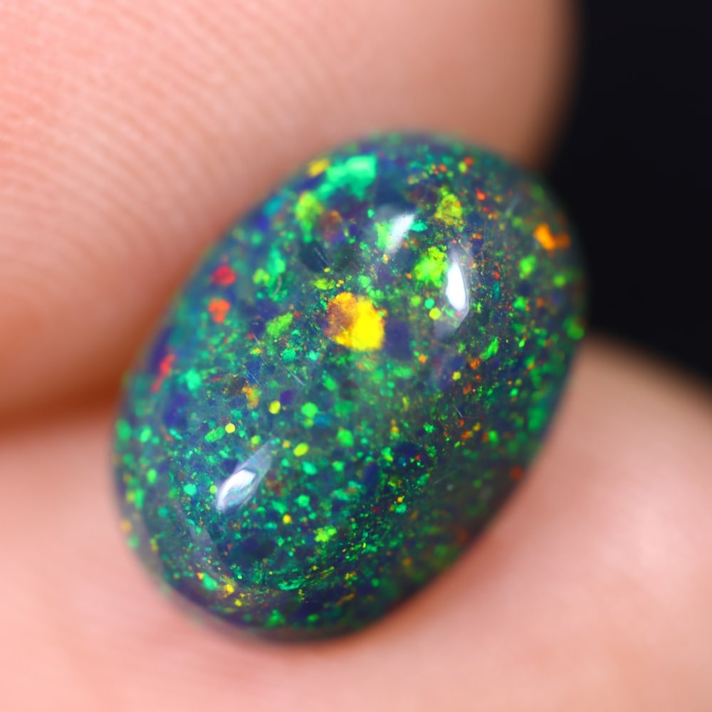 *2.01Ct Welo Black Opal Polished - Ethiopian Opal , 87E: Ksmith Heritage Auctioneers Subject: Natural Ethiopian Welo Black Opal Origin: Ethiopia Carat Weight: 2.01Ct Dimension: 11.6x8.1x4.3 mm Treatment: Smoked Type: Cabochon, P