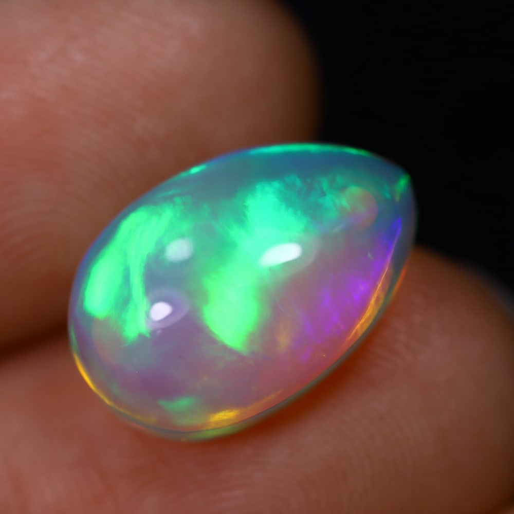 *4.98Ct Welo Opal Polished - Ethiopian Opal - Pear Cabochon, 764B: Ksmith Heritage Auctioneers Subject: Natural Ethiopian Welo Opal Origin: Ethiopia Carat Weight: 4.98Ct Dimension: 15.1 x 10.1 x 5.9 mm Treatment: Natural Untreated Shape: Pear