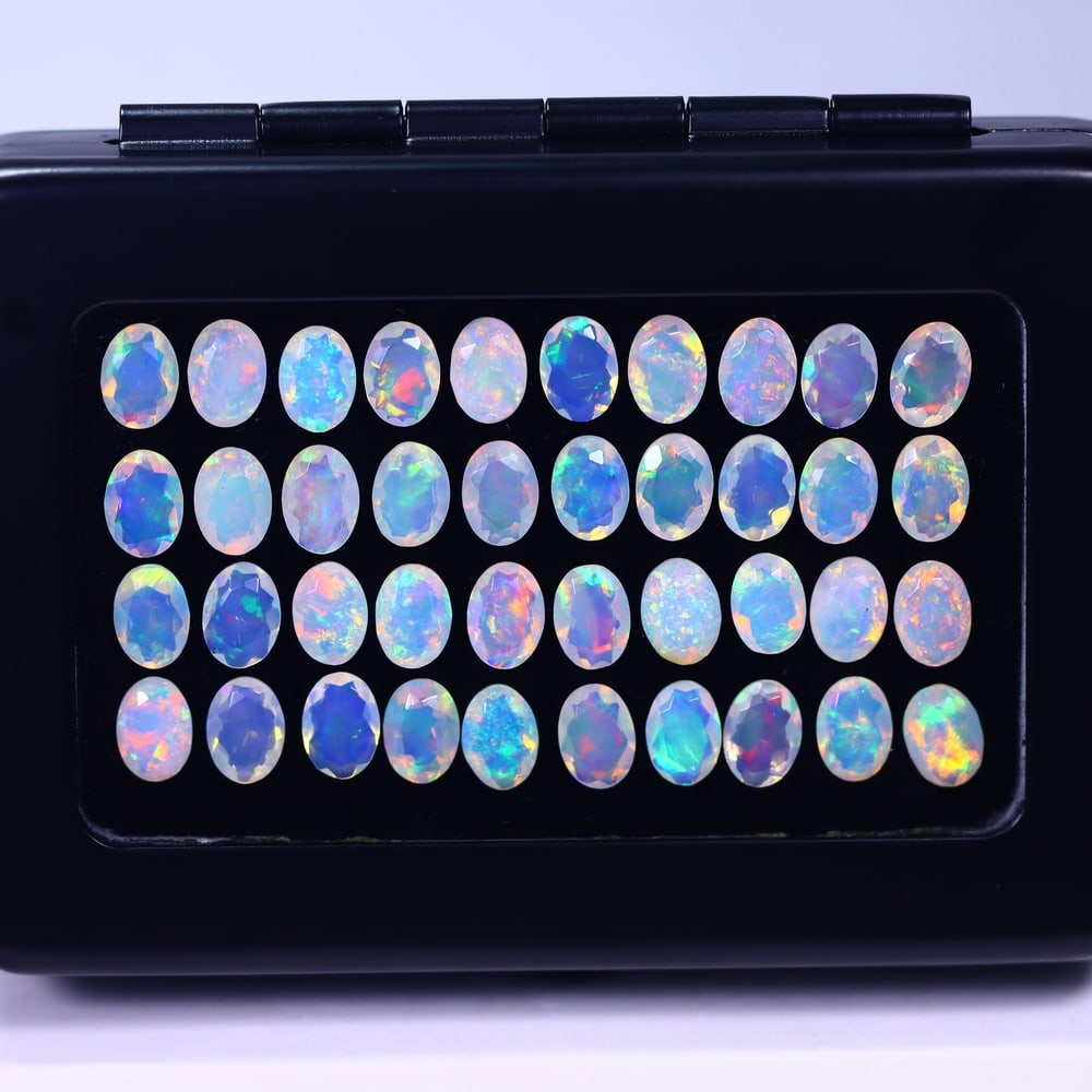 *19.67Ct Calibrated 7x5mm Faceted Welo Opal Set - Ethiopian Opal, 885B: Ksmith Heritage Auctioneers Subject: Natural Ethiopian Welo Opal Origin: Ethiopia Carat Weight: 19.67Ct Treatment: Natural Untreated Type: Faceted, Polished