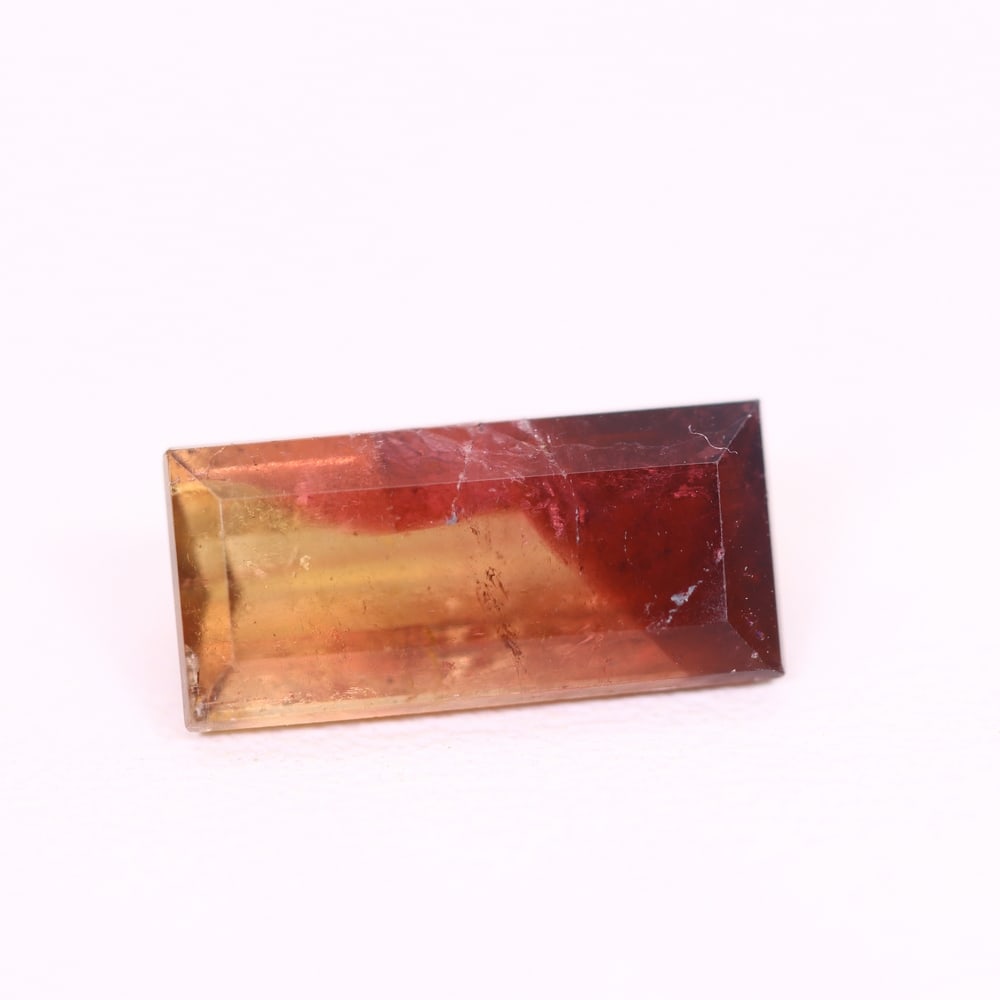 *3.14Ct Natural Watermelon Tourmaline - Bi-Colour Faceted Cut, 157C: Ksmith Heritage Auctioneers Subject: Natural Tourmaline Origin: Africa Carat Weight: 3.14 Ct Dimension: 12.9x6.1x4.1 mm Type: Faceted, Polished