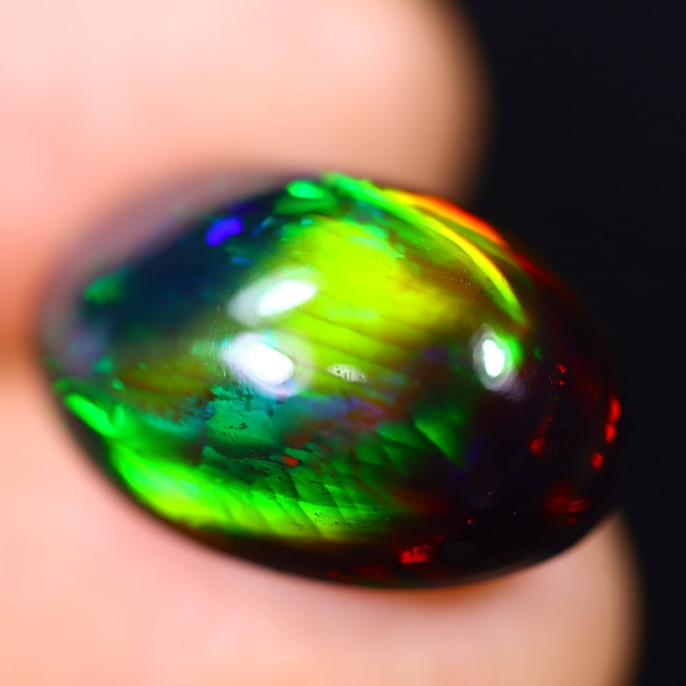 *9.93Ct Welo Black Opal Polished - Ethiopian Opal - Oval Cabochon , 64E: Ksmith Heritage Auctioneers Subject: Natural Ethiopian Welo Black Opal Origin: Ethiopia Carat Weight: 9.93Ct Dimension: 18.8 x 12.2 x 8.5 mm Treatment: Smoked Shape: Oval<