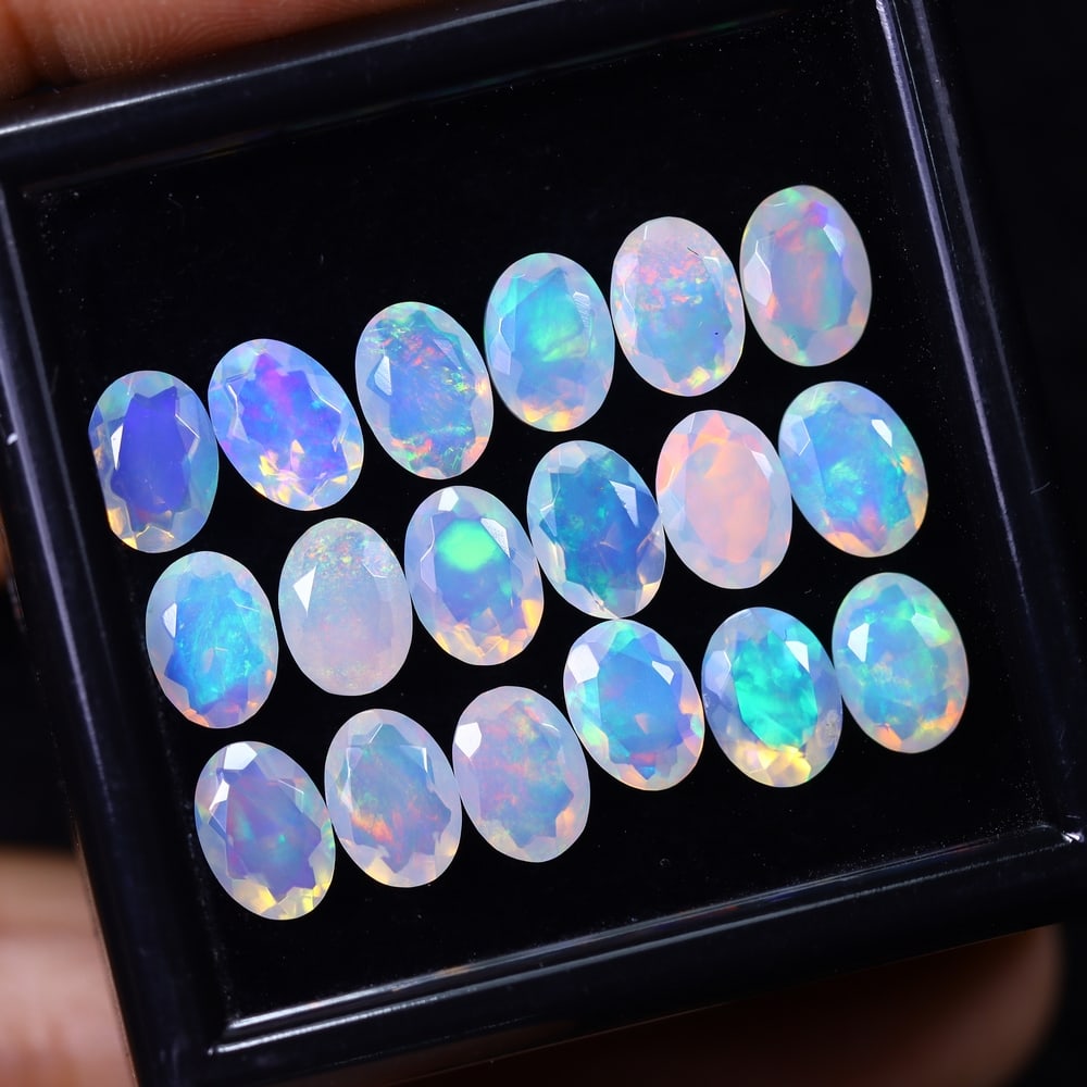 *8.92Ct 18pcs Calibrated 7x5mm Faceted Welo Opal Set - Ethiopian Opal, 898B: Ksmith Heritage Auctioneers Subject: Natural Ethiopian Welo Opal Origin: Ethiopia Carat Weight: 8.92Ct Treatment: Natural Untreated Type: Faceted, Polished